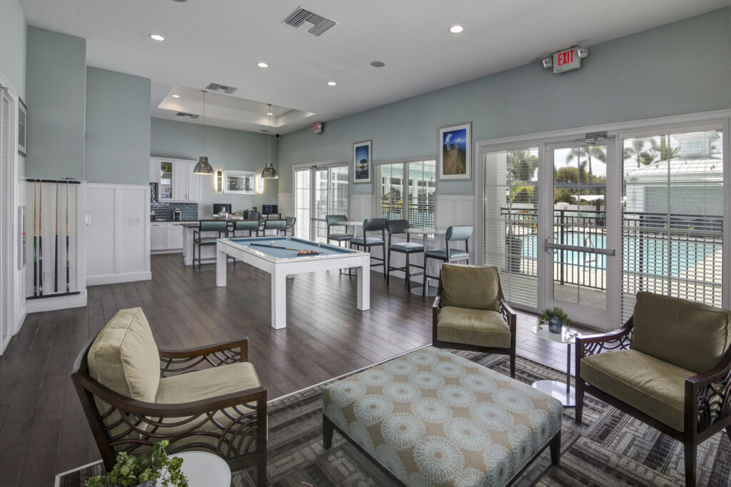 Clubhouse lounge with billiards table and kitchenette