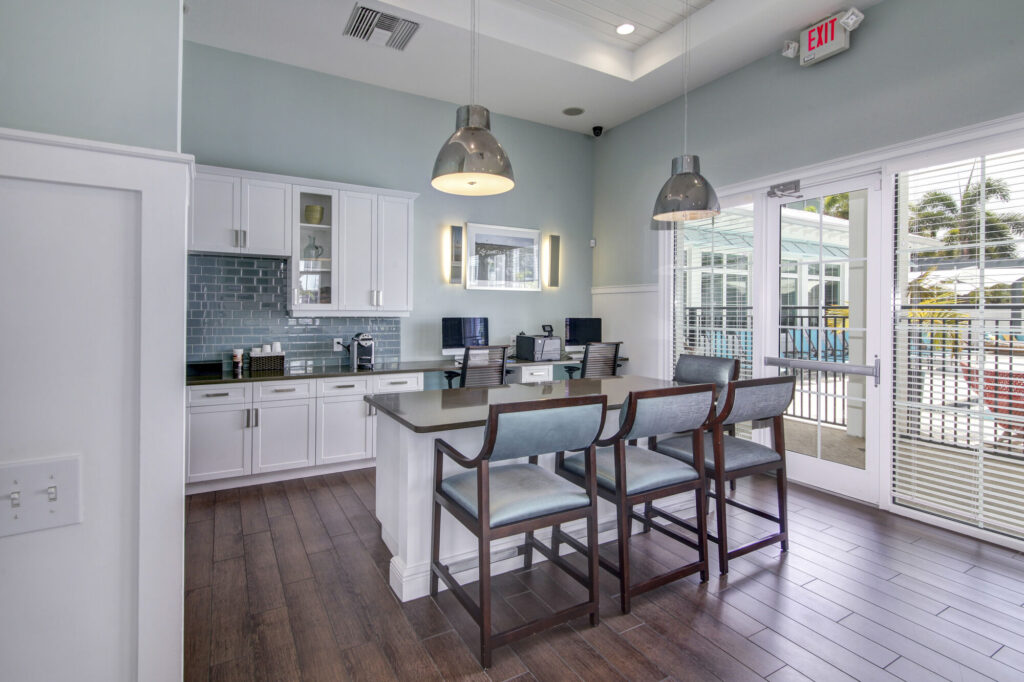 Business center with computer stations and printer and kitchenette