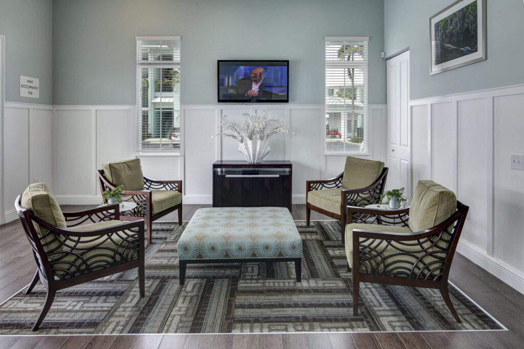 Clubhouse lounge with armchairs and TV