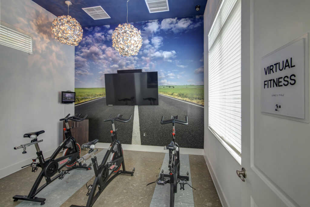 Virtual fitness room with exercise bikes and TV
